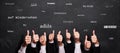 Many thumbs up and chalkboard with message GOODBYE in different languages Royalty Free Stock Photo