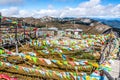 Many Tibetan Buddhist prayer flags waving with the wind at Shika mountain top Shangri-La Yunnan China Royalty Free Stock Photo