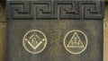 Freemasonry symbols cared into a memorial headstone