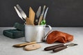 Many tools for sculpting and modeling and pieces of red clay and green plasticine on a concrete table on a black Royalty Free Stock Photo
