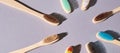Many toothbrash at table. Different color. Diagonal