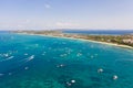 Many tourist boats near the island of Boracay. Seascape in the Philippines in sunny weather, view from above. Royalty Free Stock Photo