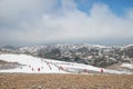 Many tourist playing snow in Valley of the Blue Moon in Shangri-La, Yunnan Province, China.