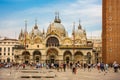 The tourists admiring the architecture of San Marco, Piazza San