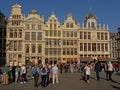 Many tourists in front of medieval guild houses in Brussels Gran Place square