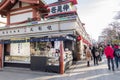 Many tourists and Japanese people are buying some sweet or dessert at the shops infront of Asakusa or Sensoji Tokyo, Japan