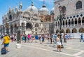 Many tourists visiting Piazzetta San Marco (St Marks Square) and Colonna di San Marco in Venice Royalty Free Stock Photo