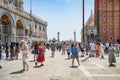 Many tourists visiting Piazzetta San Marco (St Marks Square) and Colonna di San Marco in Venice Royalty Free Stock Photo