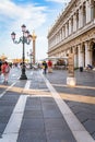 Many tourists visiting Piazzetta San Marco (St Marks Square) and Colonna di San Marco in Venice Royalty Free Stock Photo