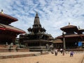 Many tourists walk through the great and ancient stone temples in Durbar Square, Patan, Kathmandu, Nepal Royalty Free Stock Photo