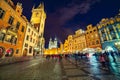 Many of tourists walking in spring night on the Old Town square with Tyn Church. Spectacular evening sityscape of capital of Czec