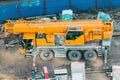 Many Truck and Crane in yard site consist of lifting, pulley, sling, derrick are ready for construction. Royalty Free Stock Photo