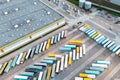 Many trucks and trailers are parked at the base, logistics and production center