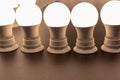 Many turned on, lighted bulbs with lampholders close up. Royalty Free Stock Photo