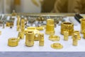 Many type and various of industrial casting and machining parts gold color or brass on table as thread connection joint nut Royalty Free Stock Photo