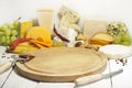 Many types of cheese on cutting board abstract