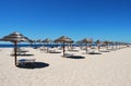 Many Umbrellas on the beach with blue sky in Tavira island,Portugal