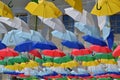 Colorful umbrellas hanging high in the sky