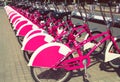 Many urban bicycles for rent are parked and waiting their customers in european city Royalty Free Stock Photo