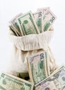 Many US dollar bills or notes with money bags Royalty Free Stock Photo