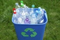 Many used bottles in trash bin outdoors. Plastic recycling Royalty Free Stock Photo