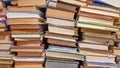 Many used old books in the school library. chaotic layout of stacks of literature, selective focus. A pile of books ends with Royalty Free Stock Photo