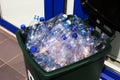 Many used plastic bottles in trash bin outdoors, closeup. Recycling problem Royalty Free Stock Photo