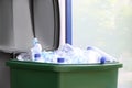 Many used plastic bottles in trash bin outdoors, closeup. Recycling problem Royalty Free Stock Photo