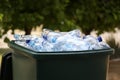 Many used plastic bottles in trash bin outdoors, closeup. Recycling problem Royalty Free Stock Photo