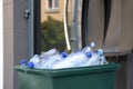 Many used plastic bottles in trash bin outdoors, closeup. Recycling problem Royalty Free Stock Photo