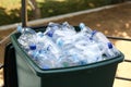 Many used plastic bottles in trash bin outdoors, closeup. Recycling problem Royalty Free Stock Photo