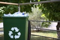 Many used plastic bottles in trash bin outdoors. Recycling problem Royalty Free Stock Photo