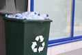 Many used plastic bottles in trash bin outdoors. Recycling problem Royalty Free Stock Photo