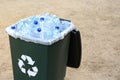 Many used plastic bottles in trash bin outdoors. Recycling problem Royalty Free Stock Photo