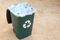 Many used plastic bottles in trash bin outdoors, space for text. Recycling problem Royalty Free Stock Photo