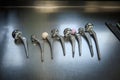 various explanted hip joint prostheses lying next to each other on the table Royalty Free Stock Photo