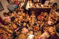 Many vintage dolls in room of the Doll Hospital, vintage doll restoration shop and museum