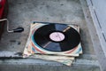 Many vintage vinyl records lays outside house. Old style to listen music