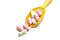 Many vitamins are in the wooden spoon on white background, Health tonic, Business selling drugs