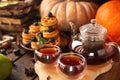 Many waffles are stacked on a plate, decorated with mint leaves and blueberries. Tea in a glass teapot and two small bowls Royalty Free Stock Photo