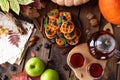 Many waffles are stacked on a plate, decorated with mint leaves and blueberries. Tea in a glass teapot and two small bowls Royalty Free Stock Photo