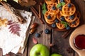 Many waffles are stacked on a plate, decorated with mint leaves and blueberries. Tea in a glass teapot and two small bowls Royalty Free Stock Photo