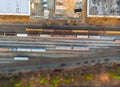 Containers in railway station in a sump many wagons and trains aerial view