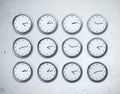 Many wall clocks showing time Royalty Free Stock Photo
