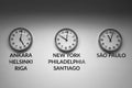 Many wall clocks on the white wall of business office showing time of different cities of the world Royalty Free Stock Photo