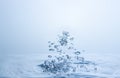 Many water droplets are both sharp and blurry. Falling on the water surface light blue Royalty Free Stock Photo