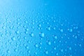 Many water drops on blue background Royalty Free Stock Photo