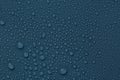 Many water drops on dusty blue background Royalty Free Stock Photo