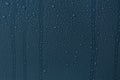 Many water drops on dark dusty blue background Royalty Free Stock Photo