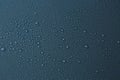 Many water drops on dark dusty blue background Royalty Free Stock Photo